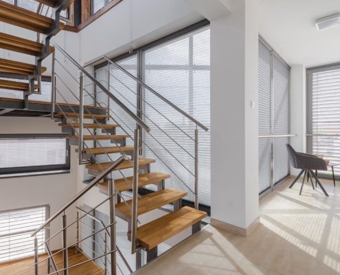 View of a modern office with a steel staircase